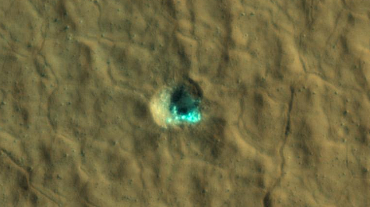 Ice-Exposing Impact Crater Surrounded by Polygon Terrain On Mars