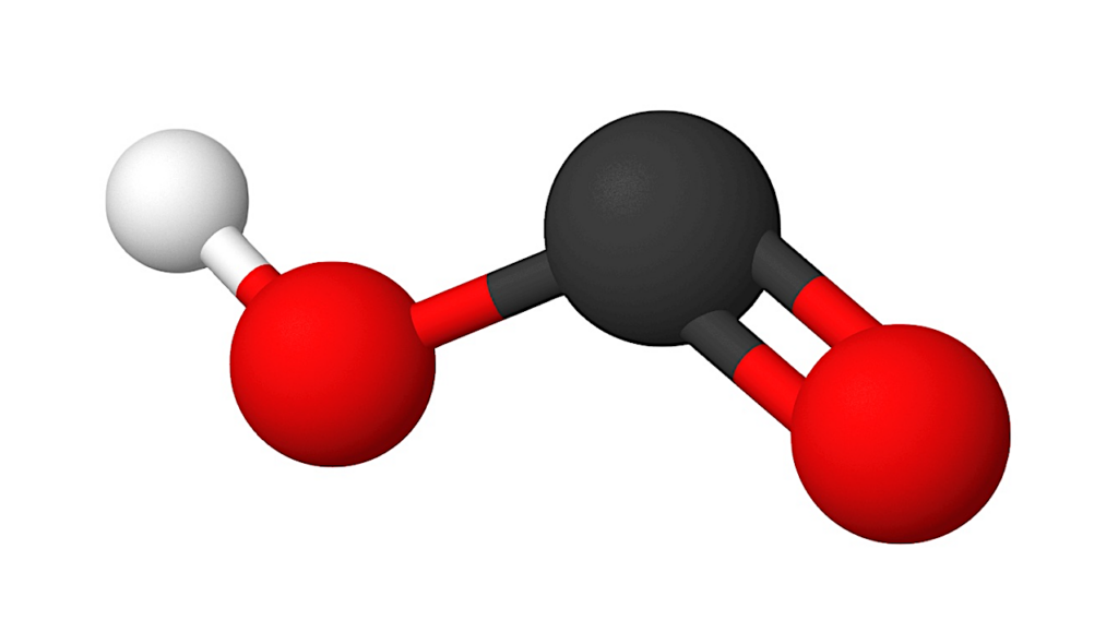 Proposed Importance Of HOCO Chemistry: Inefficient Formation Of CO2 From CO And OH Reactions On Ice Dust