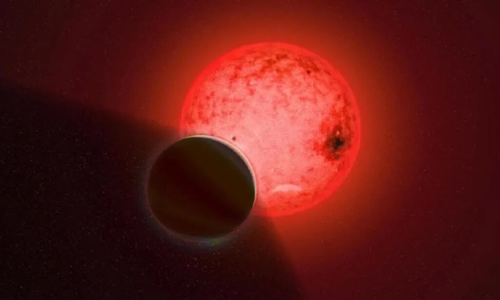 Giant Planet TOI-5205 b Orbits A Small Red Star